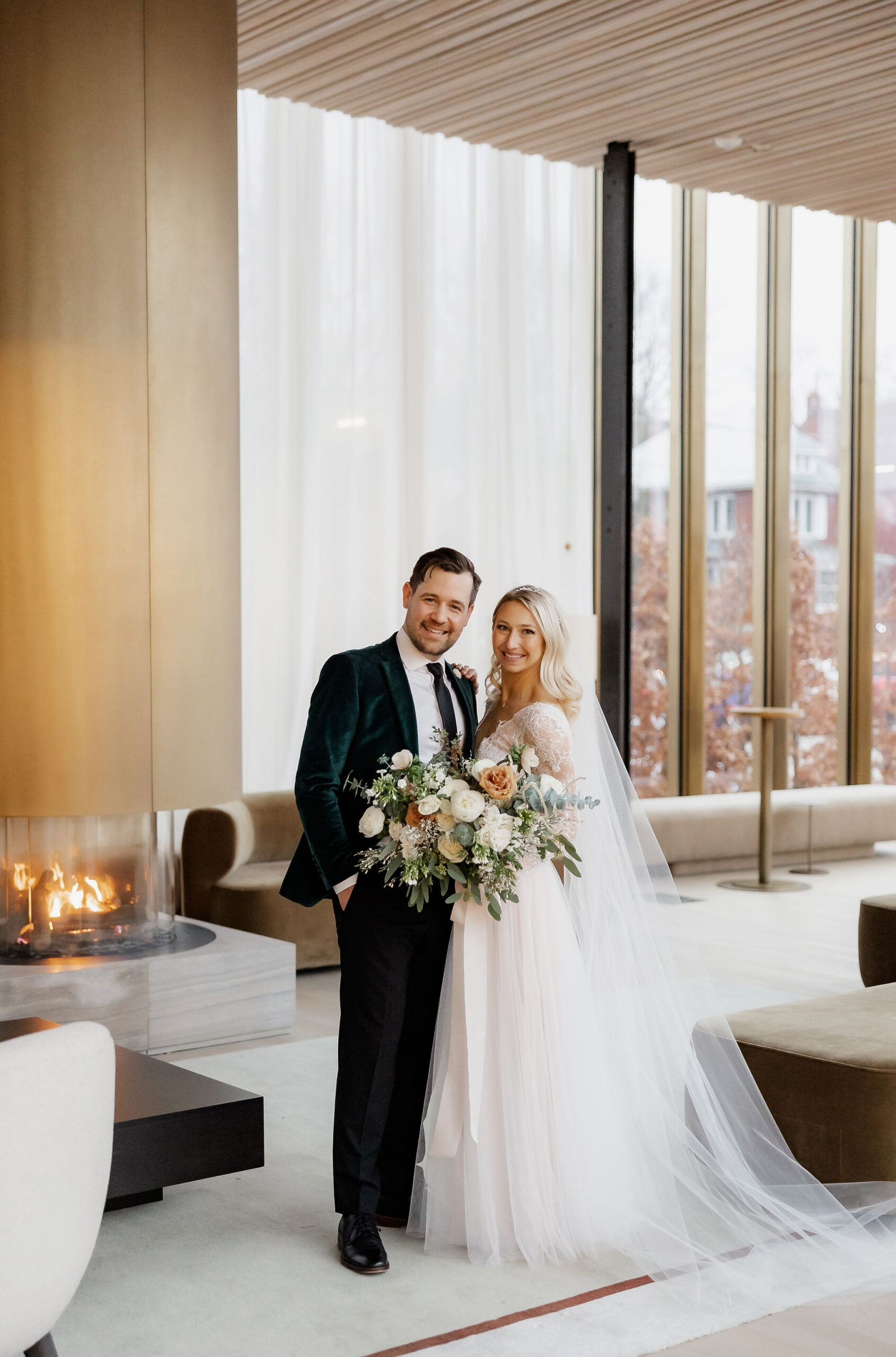 Bride and groom winter wedding portraits in Spriet Lounge at Tom Patterson Theatre in Stratford